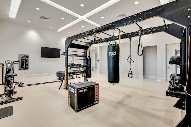 workout area with baseboards, visible vents, and recessed lighting