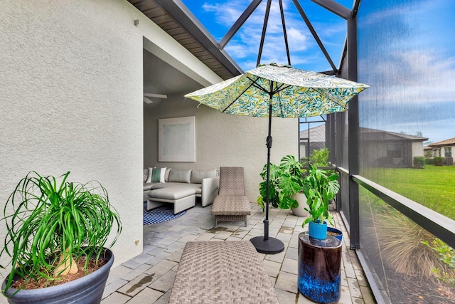 view of patio / terrace featuring a lanai