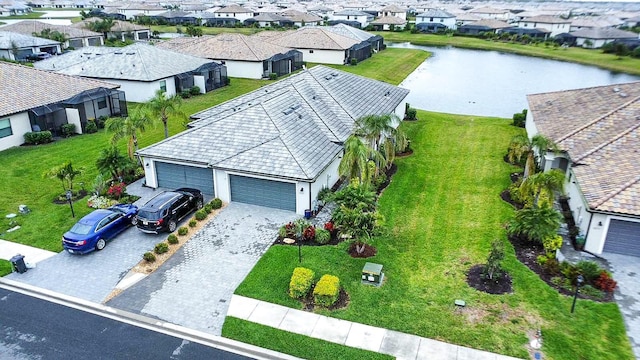 bird's eye view with a water view and a residential view