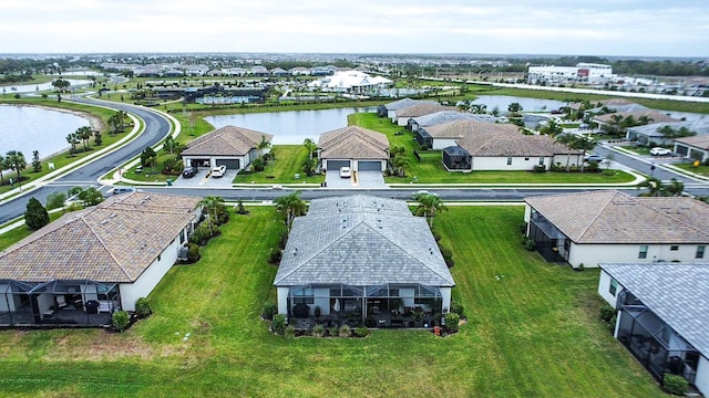 birds eye view of property featuring a residential view and a water view