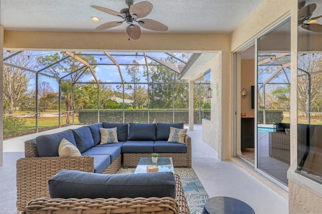 sunroom featuring a ceiling fan