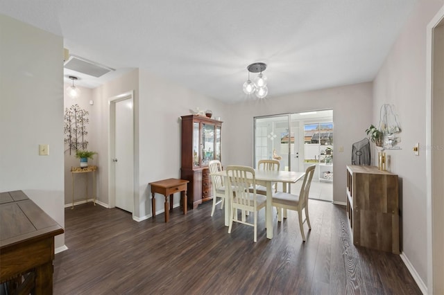 dining room with dark wood-style floors and baseboards