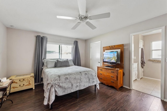 bedroom with dark wood-style flooring, ceiling fan, and baseboards