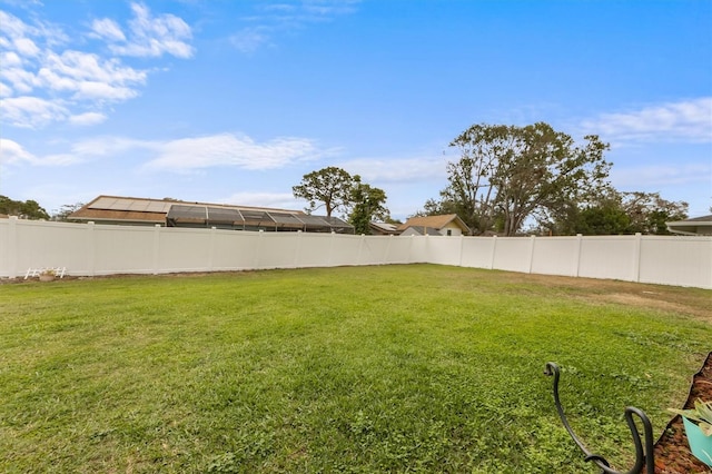 view of yard featuring a fenced backyard