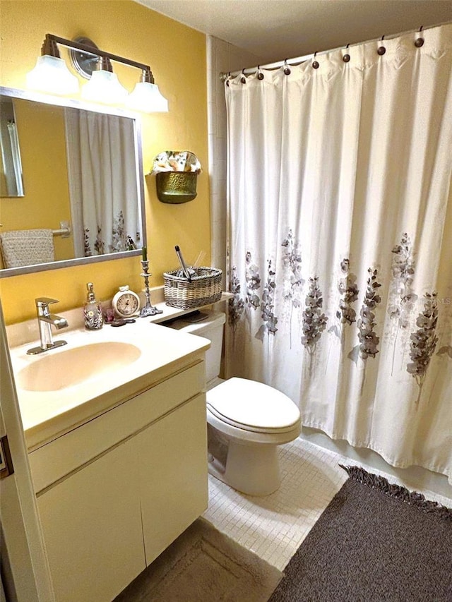 full bathroom with toilet, vanity, a shower with shower curtain, and tile patterned floors