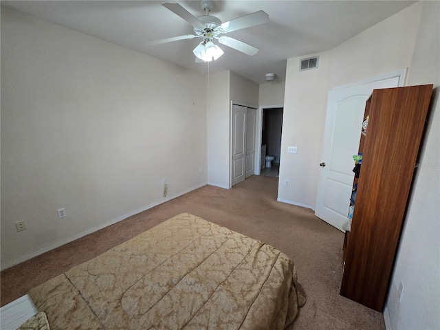 bedroom with ceiling fan, carpet flooring, visible vents, baseboards, and a closet