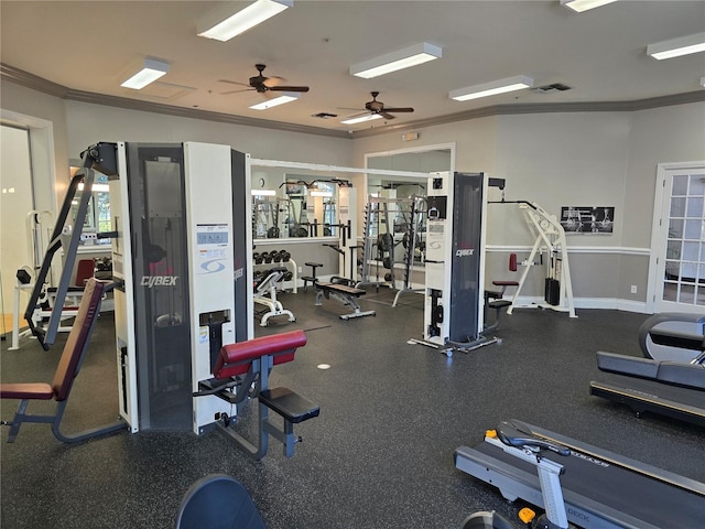 gym with ornamental molding, visible vents, and baseboards