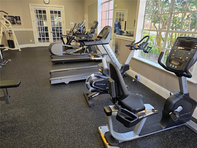 workout area featuring french doors and baseboards