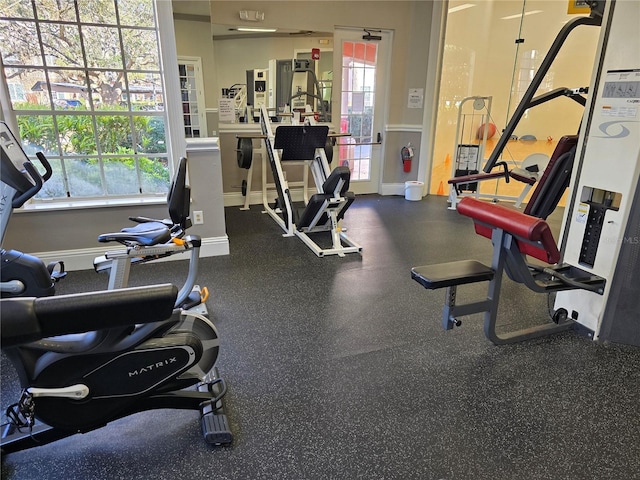 workout area featuring baseboards