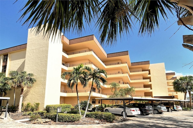 8779 Midnight Pass Rd Unit 406H, Sarasota, FL 34242 - view of apartment building / complex with covered parking