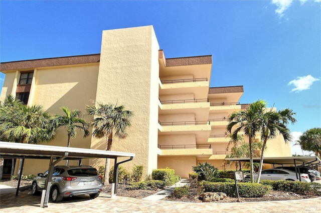 8779 Midnight Pass Rd Unit 406H, Sarasota, FL 34242 - view of property with covered parking