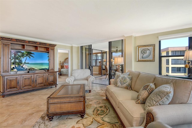 8779 Midnight Pass Rd Unit 406H, Sarasota, FL 34242 - living room with ornamental molding, plenty of natural light, light tile patterned flooring, and ceiling fan