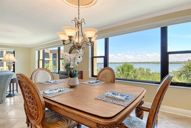 8779 Midnight Pass Rd Unit 406H, Sarasota, FL 34242 - dining area featuring crown molding, a chandelier, light tile patterned floors, a water view, and baseboards