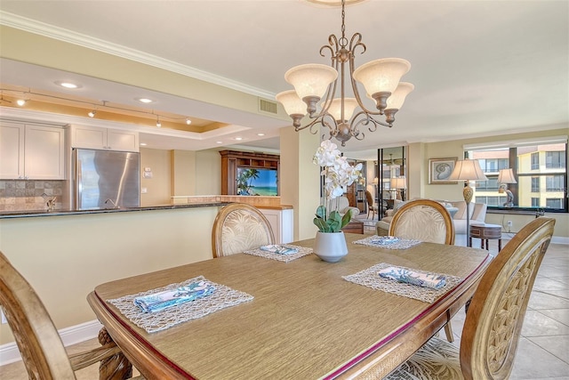 8779 Midnight Pass Rd Unit 406H, Sarasota, FL 34242 - dining area featuring crown molding, light tile patterned floors, a chandelier, and baseboards