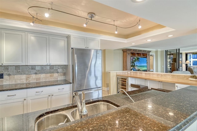 8779 Midnight Pass Rd Unit 406H, Sarasota, FL 34242 - kitchen featuring freestanding refrigerator, wine cooler, backsplash, dark stone countertops, and recessed lighting