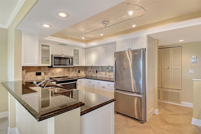 8779 Midnight Pass Rd Unit 406H, Sarasota, FL 34242 - kitchen featuring stainless steel appliances, dark stone countertops, white cabinetry, a peninsula, and recessed lighting
