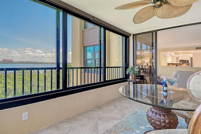 8779 Midnight Pass Rd Unit 406H, Sarasota, FL 34242 - sunroom / solarium featuring tile patterned floors and a water view
