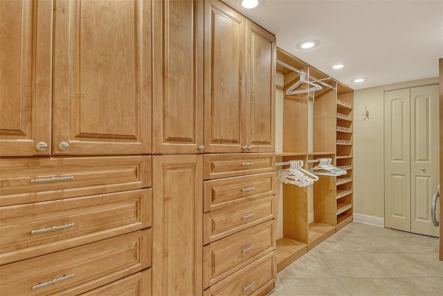 8779 Midnight Pass Rd Unit 406H, Sarasota, FL 34242 - walk in closet with light tile patterned flooring
