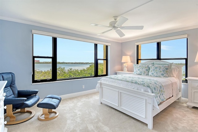 8779 Midnight Pass Rd Unit 406H, Sarasota, FL 34242 - bedroom with light carpet, ornamental molding, baseboards, multiple windows, and a water view