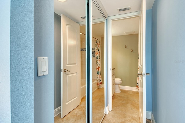 8779 Midnight Pass Rd Unit 406H, Sarasota, FL 34242 - bathroom featuring toilet, shower / tub combo, tile patterned flooring, and baseboards