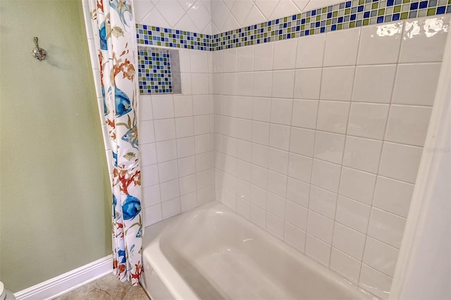 8779 Midnight Pass Rd Unit 406H, Sarasota, FL 34242 - bathroom featuring baseboards and shower / bath combination with curtain