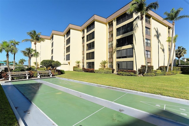 8779 Midnight Pass Rd Unit 406H, Sarasota, FL 34242 - view of property's community featuring shuffleboard and a yard