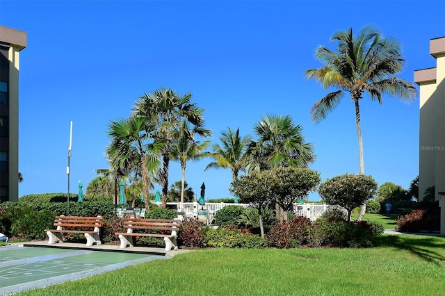 8779 Midnight Pass Rd Unit 406H, Sarasota, FL 34242 - surrounding community featuring a lawn and shuffleboard