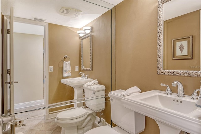 8779 Midnight Pass Rd Unit 406H, Sarasota, FL 34242 - half bath featuring toilet and tile patterned flooring