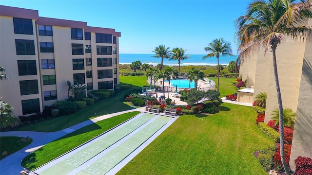 8779 Midnight Pass Rd Unit 406H, Sarasota, FL 34242 - view of grassy yard with shuffleboard and a water view