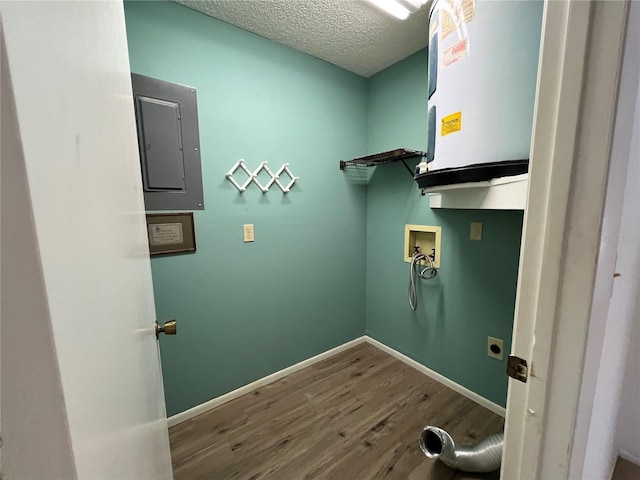 laundry area featuring a textured ceiling, hookup for an electric dryer, laundry area, washer hookup, and wood finished floors