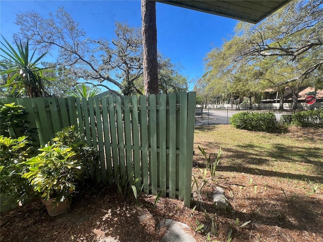 view of gate featuring fence