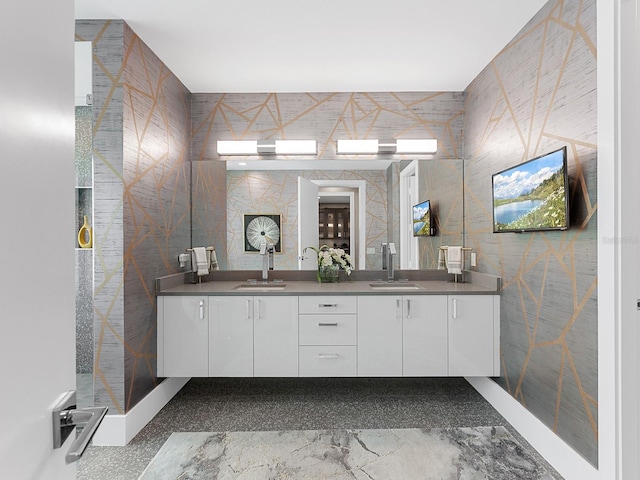 bathroom featuring double vanity and a sink