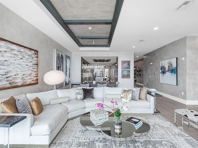 living area with visible vents, recessed lighting, baseboards, and wood finished floors