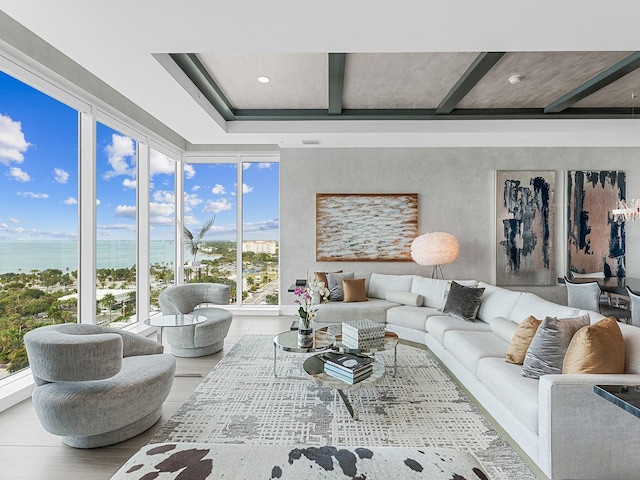 living area with beamed ceiling, recessed lighting, and wood finished floors