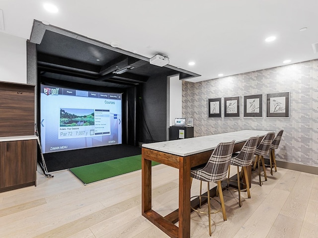 interior space with light wood-style flooring, golf simulator, recessed lighting, wallpapered walls, and baseboards