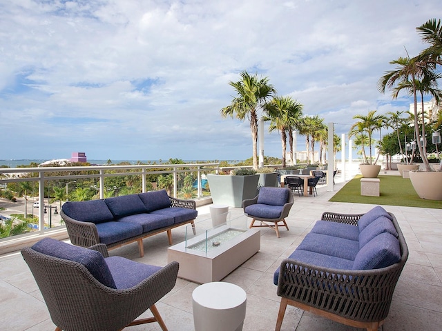 view of patio / terrace with an outdoor living space with a fire pit