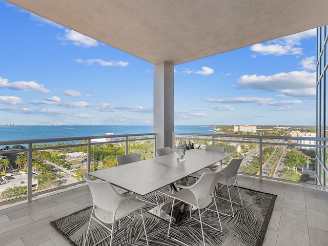 balcony featuring a water view