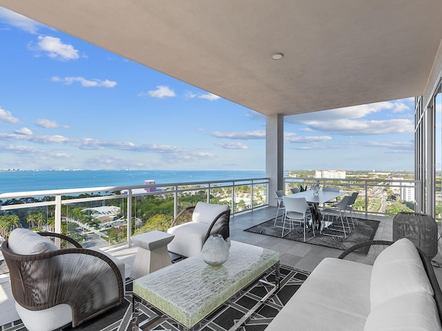 balcony featuring an outdoor hangout area and a water view