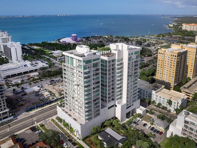 birds eye view of property with a water view and a city view