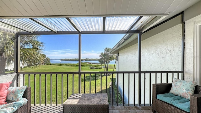 sunroom with a water view