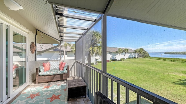 balcony featuring a water view