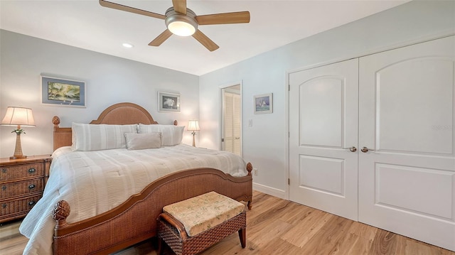 bedroom featuring light wood-style flooring and a ceiling fan