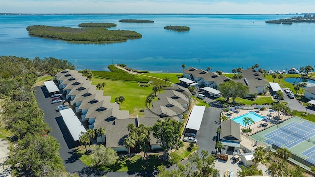 birds eye view of property with a water view