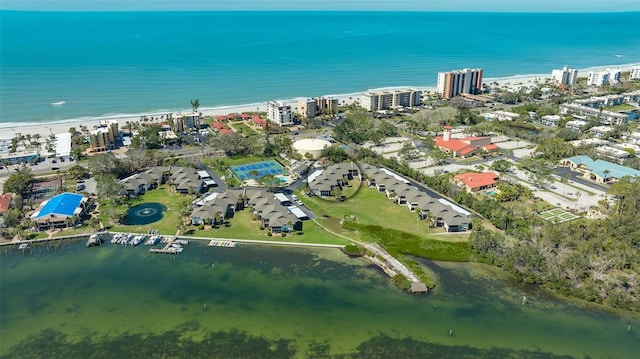 birds eye view of property with a city view and a water view