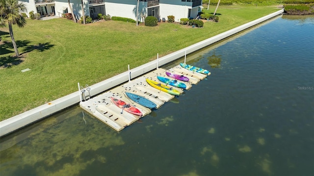 dock area featuring a yard and a water view