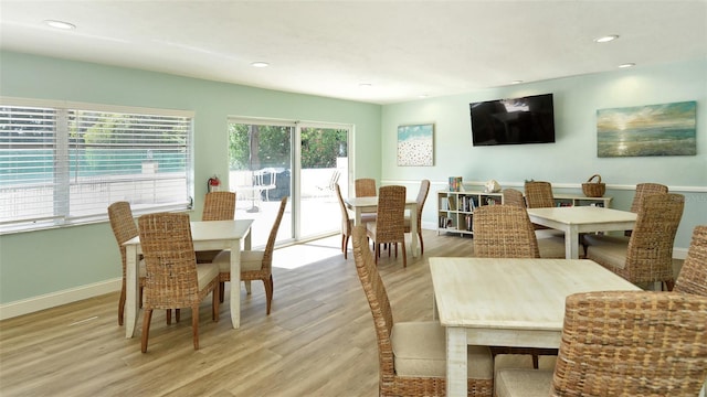 dining area featuring recessed lighting, light wood-type flooring, and baseboards