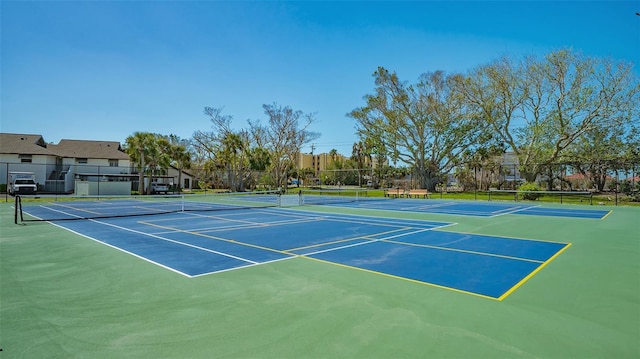 view of sport court with fence