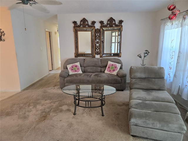 carpeted living area featuring ceiling fan