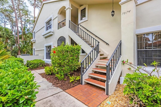 property entrance featuring stucco siding