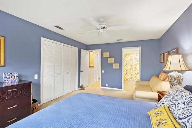 carpeted bedroom featuring a ceiling fan, baseboards, visible vents, and a closet